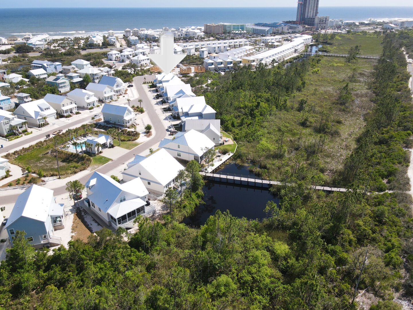 Ariel view of the Village of Tannin and the bridge to the Gulf State Park