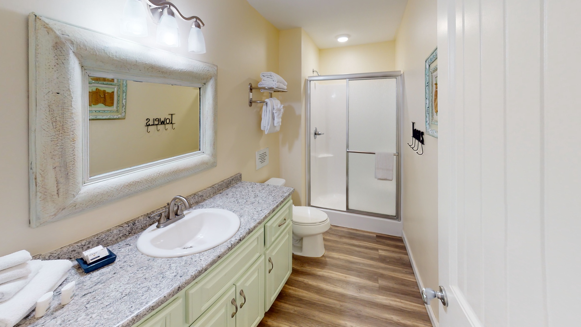 Shared hall bathroom with a walk-in shower