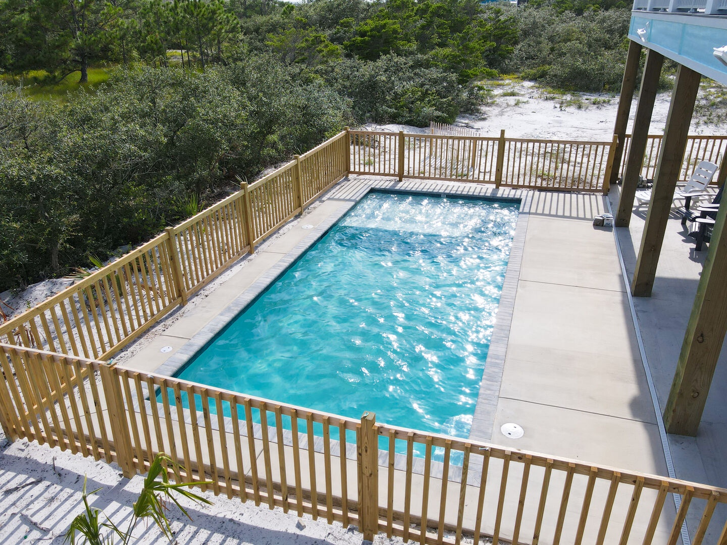 Large private pool with a secure fenced in area plus seating