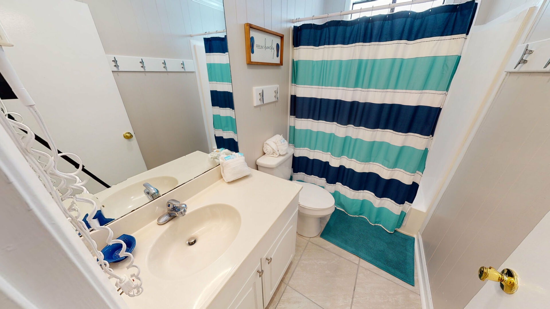 Full bath located between bedroom 3 and 4 with shower tub combo