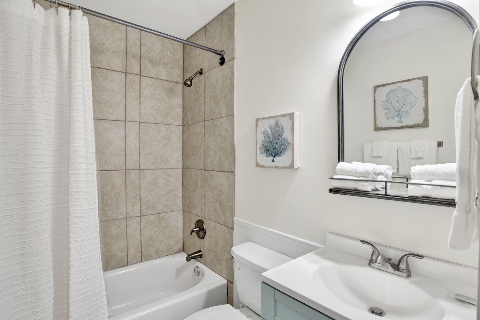 1st floor shared bathroom with a tub/shower combo