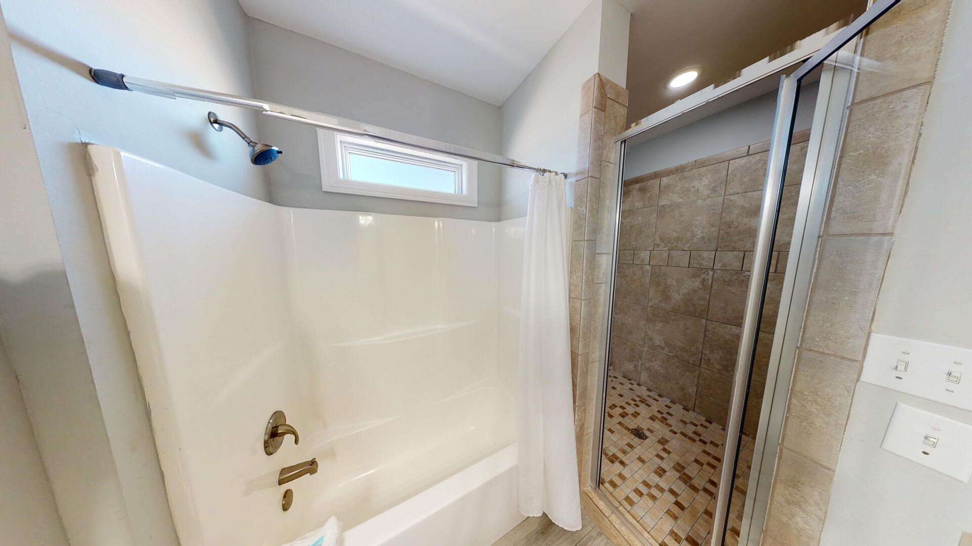 The 3rd floor bathroom has a tub shower combo and a walk-in shower