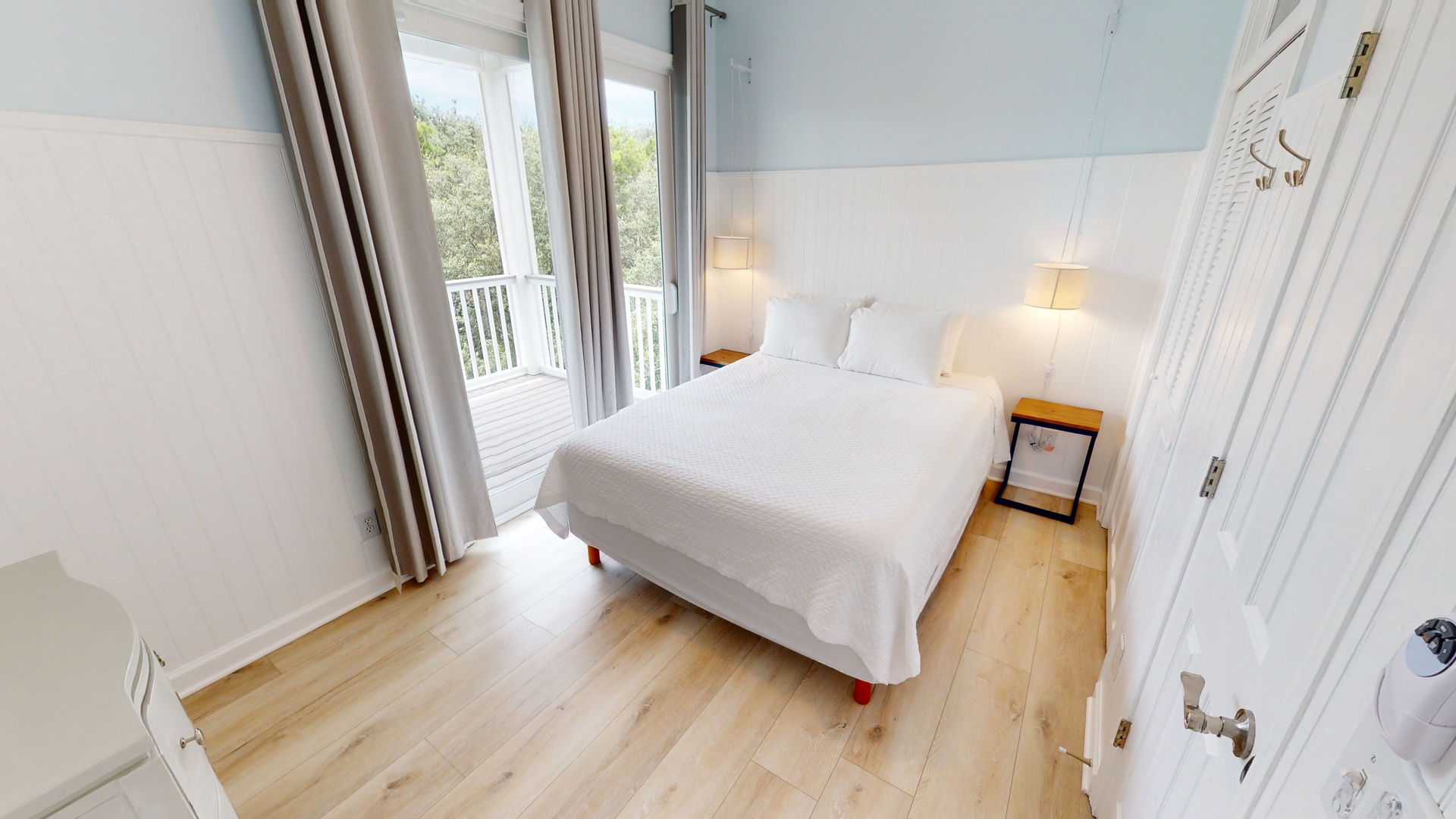 Little-Blue-Bedroom 1 is on the 2nd floor with a queen bed, ceiling fan, TV and balcony access
