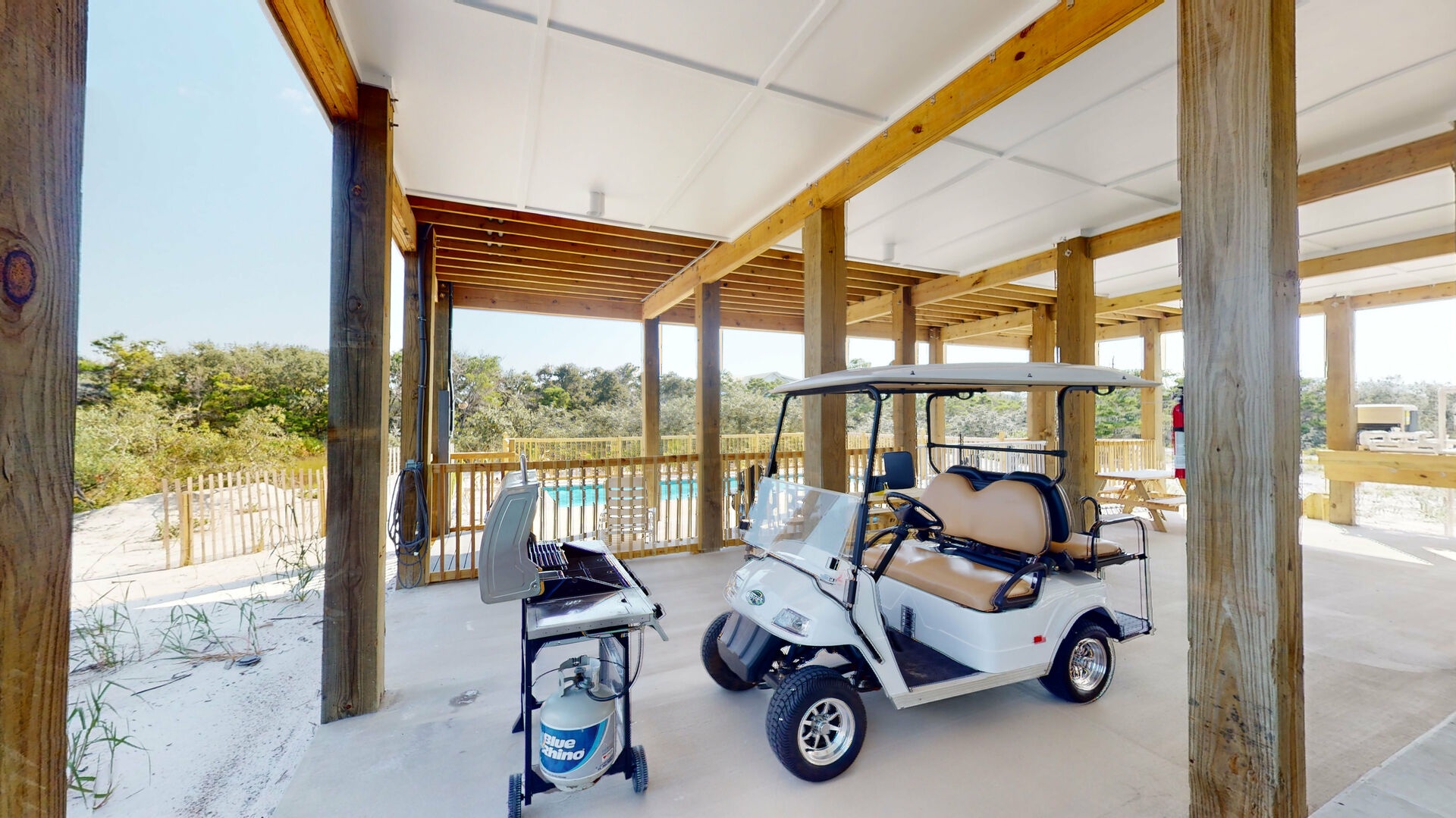 Home features electric car charging,covered dining, gas grill, golf cart storage and giant chess game