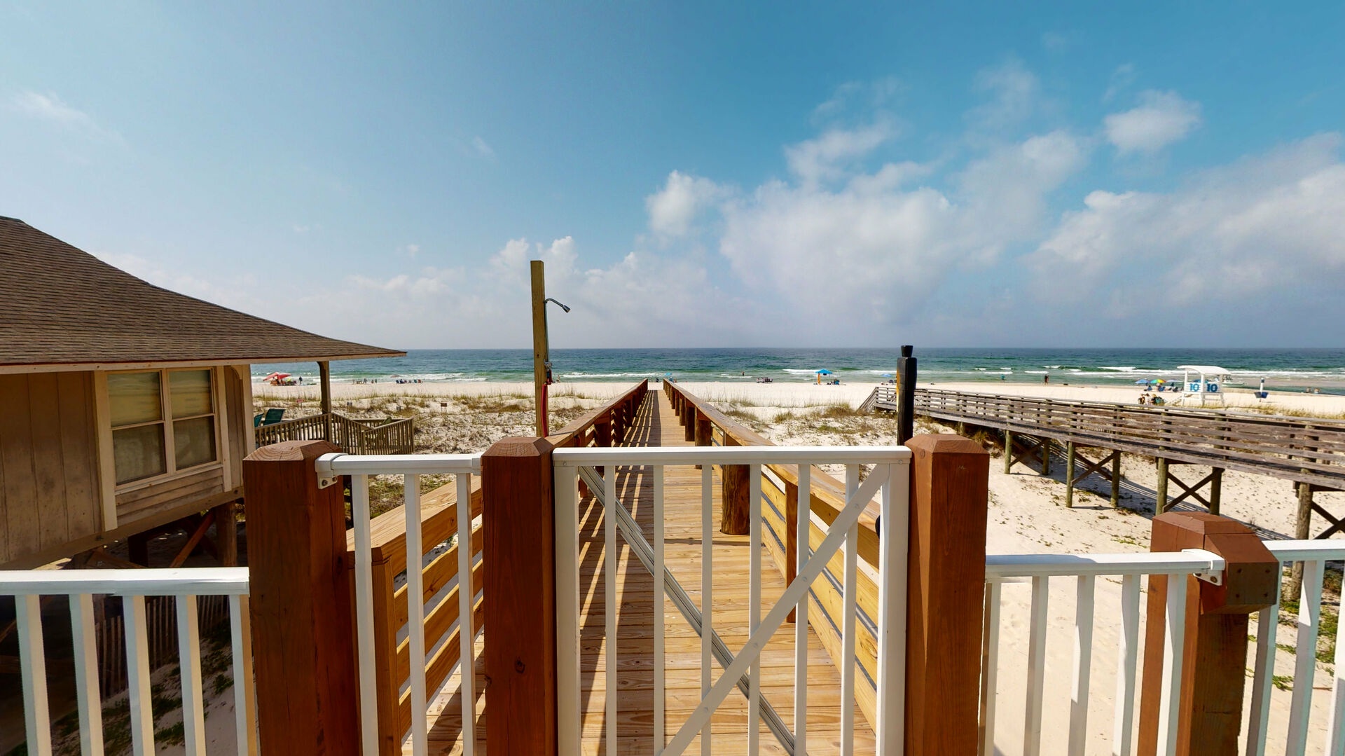 The beach walk-over has a gate and an outdoor shower