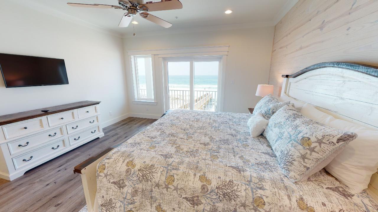 Bedroom 2 has a TV, Gulf views, balcony access and a private bathroom