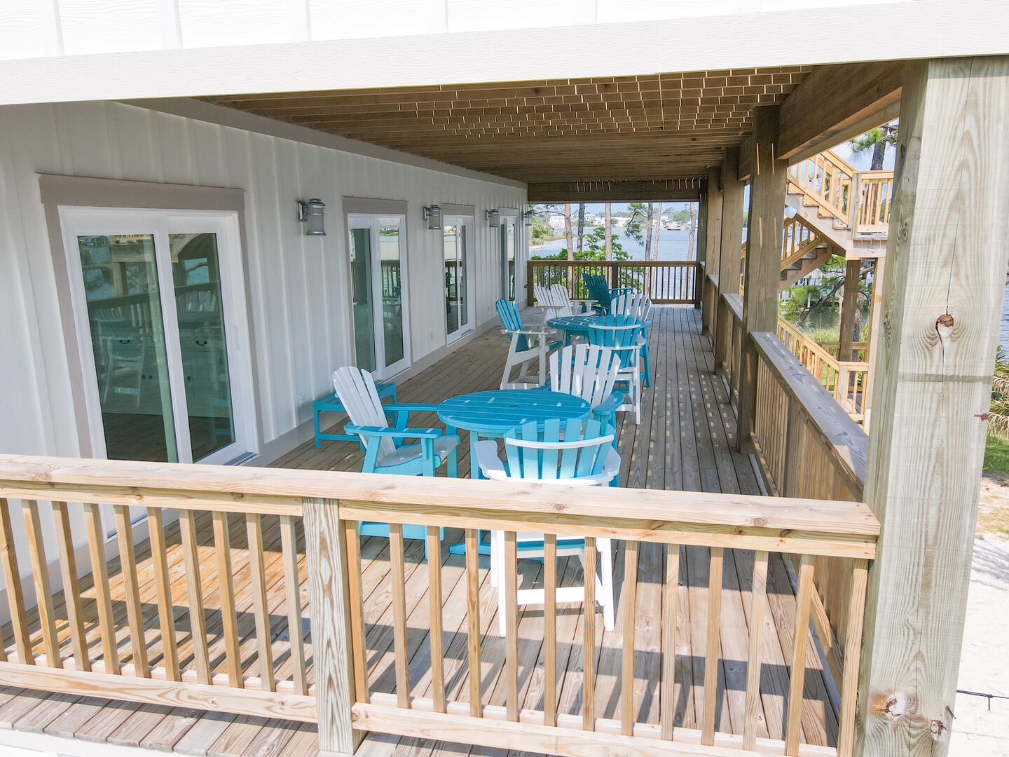 The second level deck provides several bistro tables and chairs with great views of the Bayou
