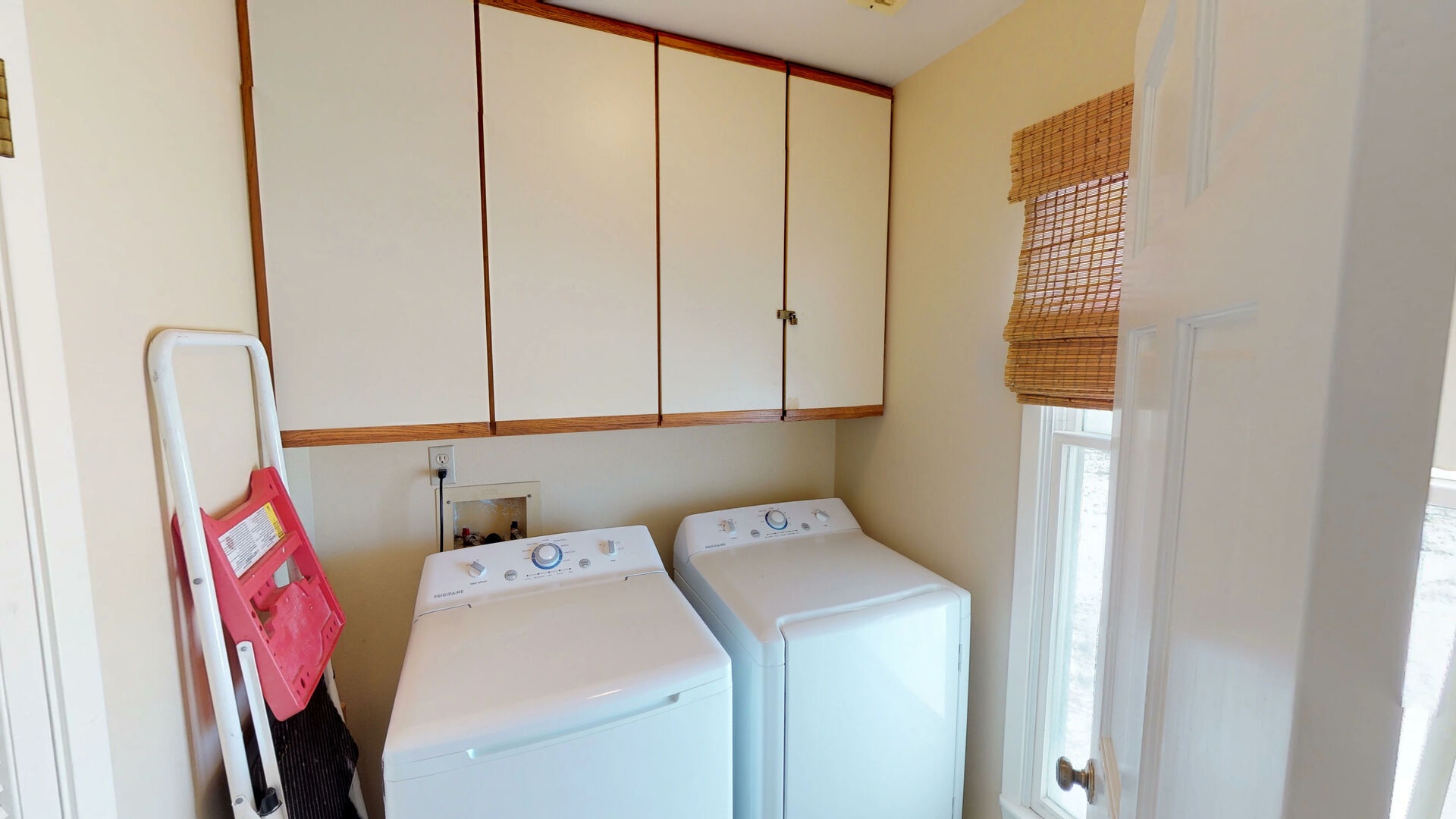Laundry room next to kitchen
