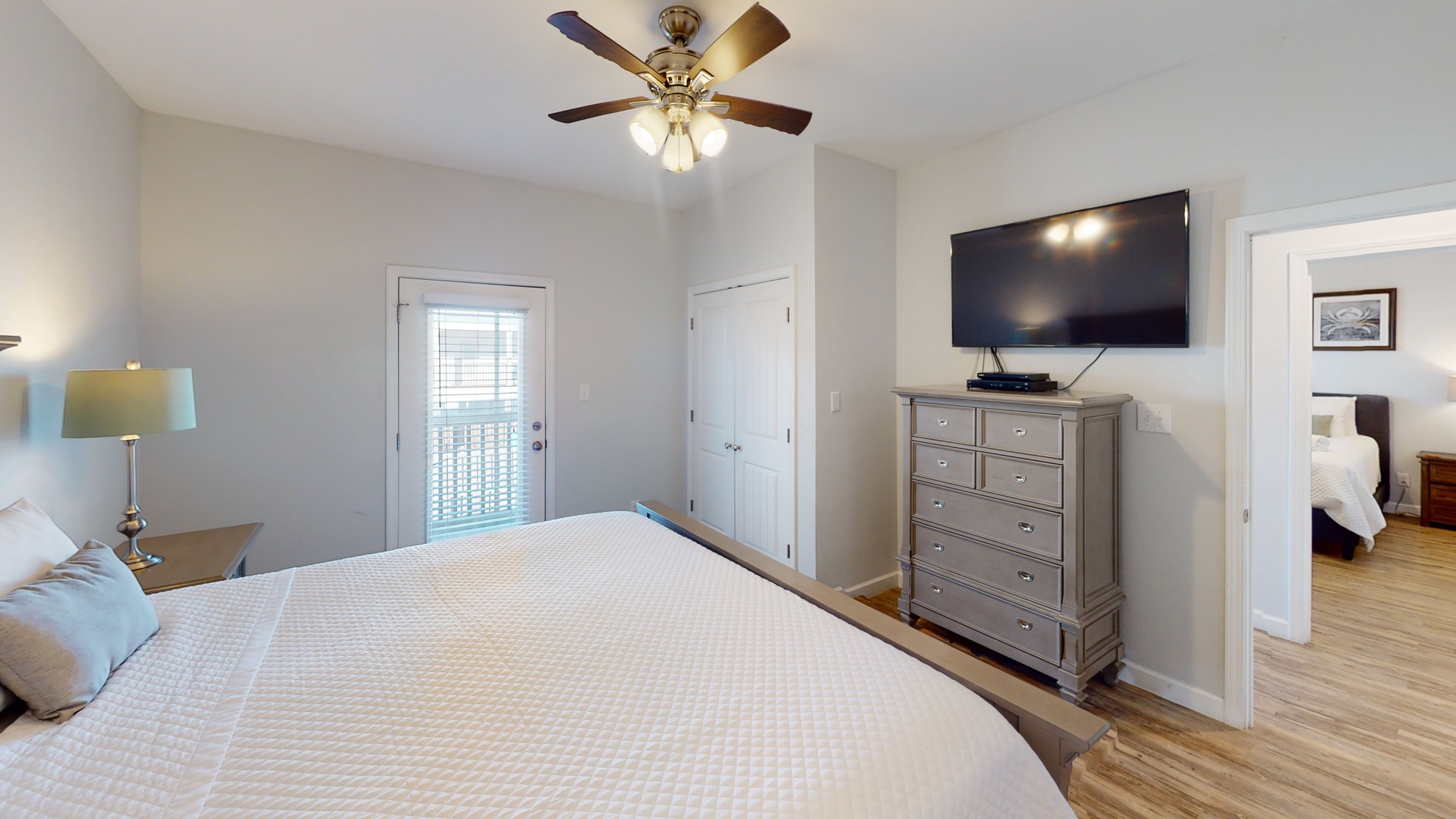There is access to the screened-in porch, a TV and a private bathroom in the Master bedroom
