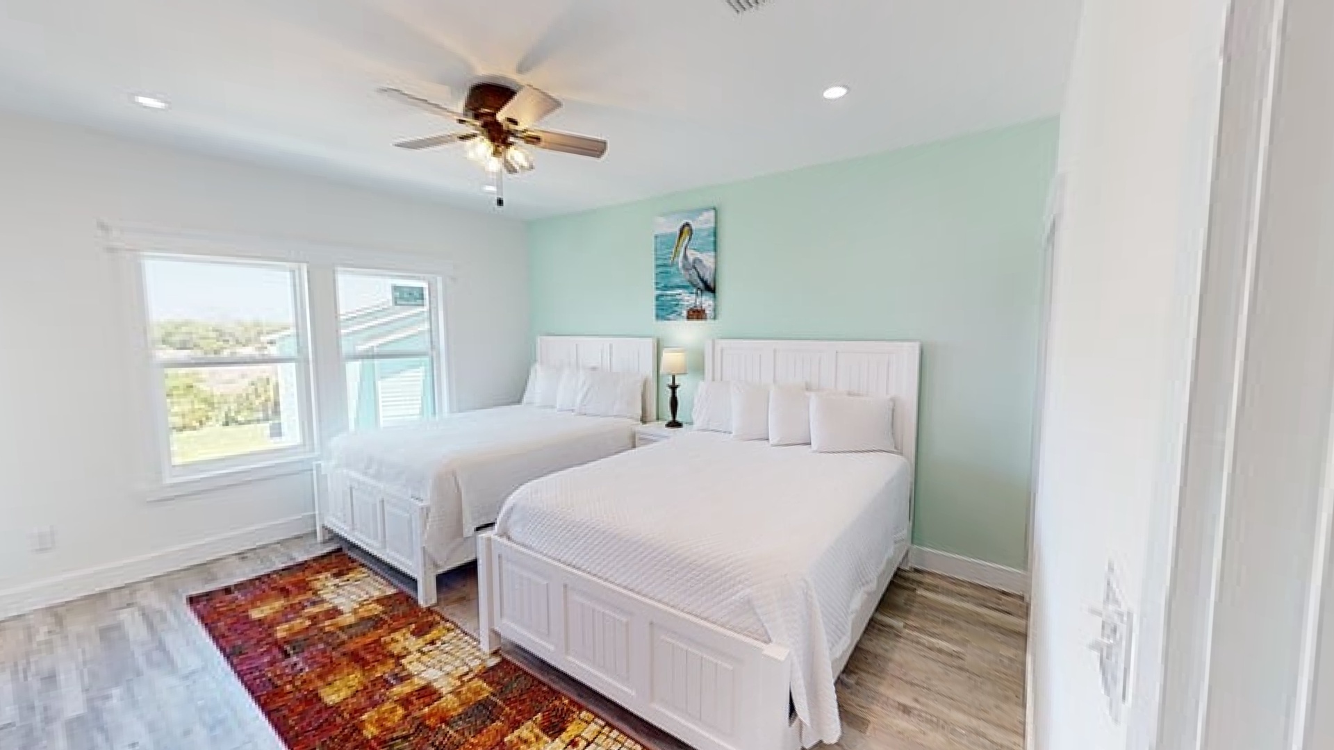 Bedroom 6 is on the 2nd floor and features 2 queen beds and a private bathroom