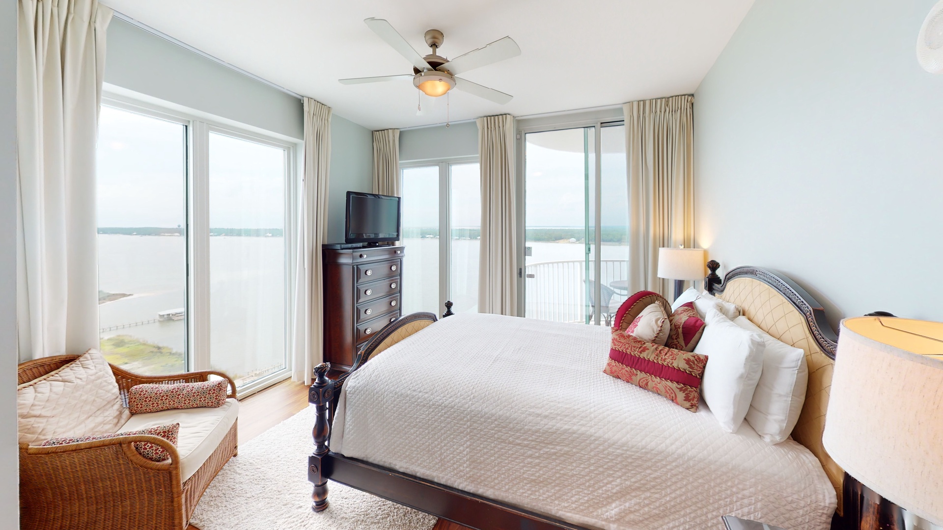 Bedroom 2 has water views, balcony access, TV and a private bathroom