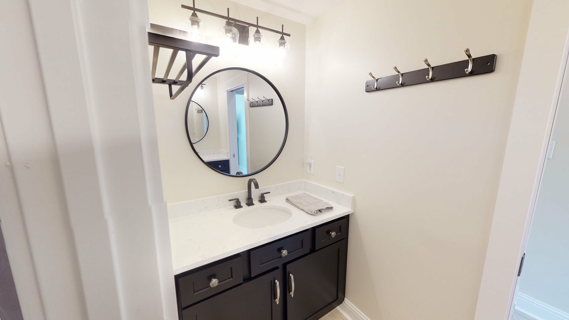 Bath shared between bedroom 3 and 4, double sinks, vanities and shower-tub combo