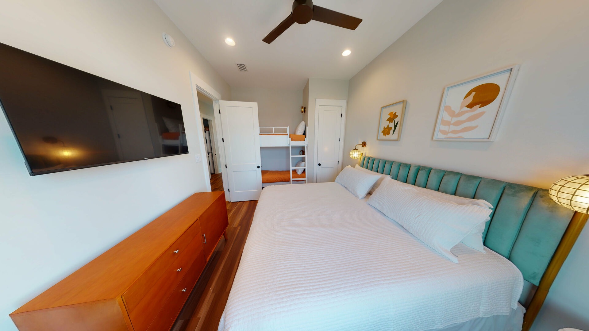 Bedroom #6 on the 3rd floor sleeps 4 in a king + 2 twin bunks. The room also has a private bathroom and a TV