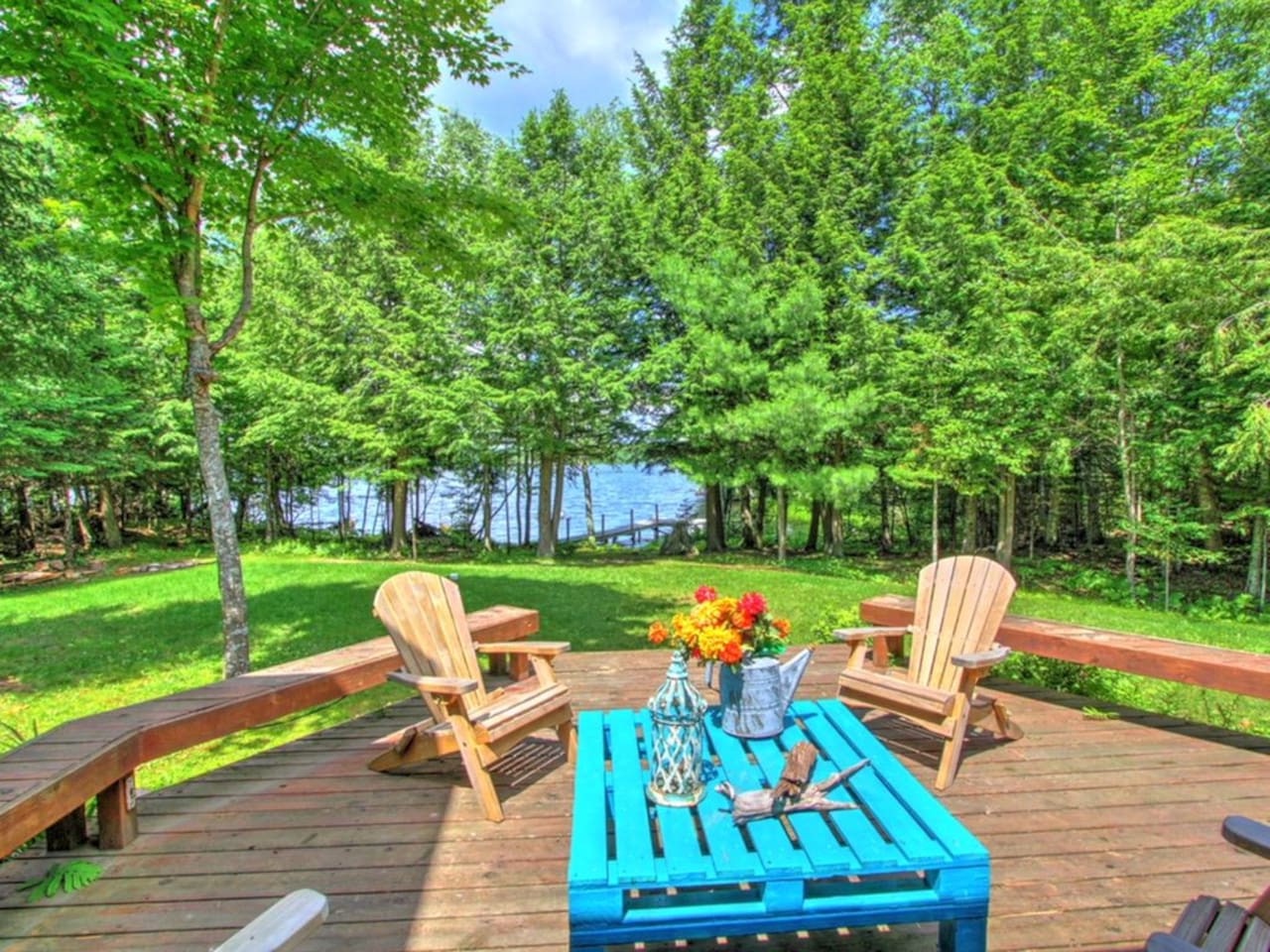 Unwind in your private wooden deck overlooking the tranquil lake, where morning coffee and evening sunsets become cherished memories.