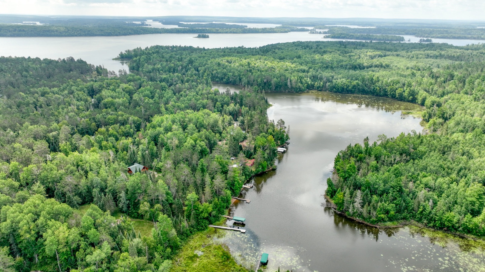 Pristine lakefront wilderness showcasing endless waterways surrounded by dense forests and secluded shoreline properties.