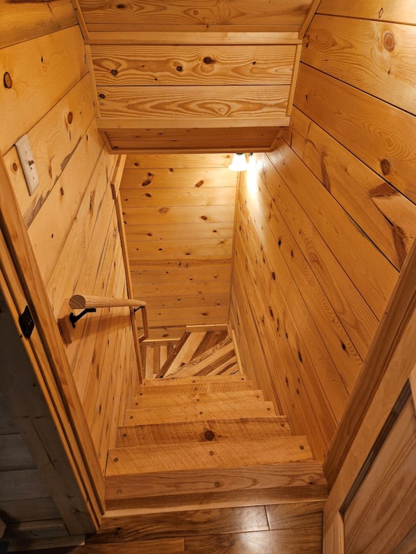 Step into your private wooden sauna, where aromatic cedar envelops you in warmth and tranquility for the ultimate relaxation experience.
