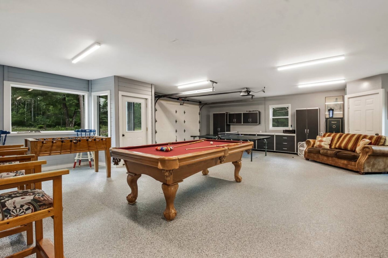 Challenge friends to pool or foosball in your spacious game room, complete with cozy seating for watching the action unfold.