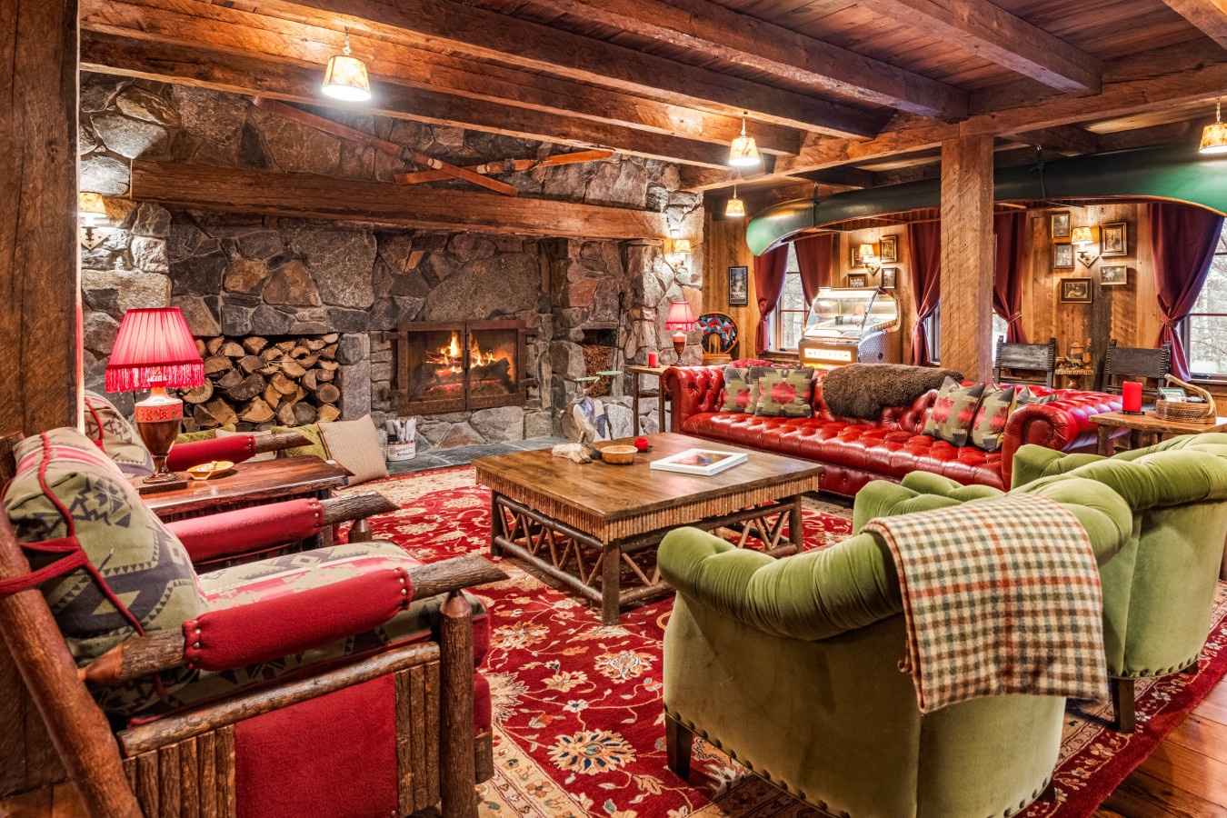 Cozy up in your rustic living room with crackling fireplace, exposed beams, and plush seating perfect for mountain evenings.