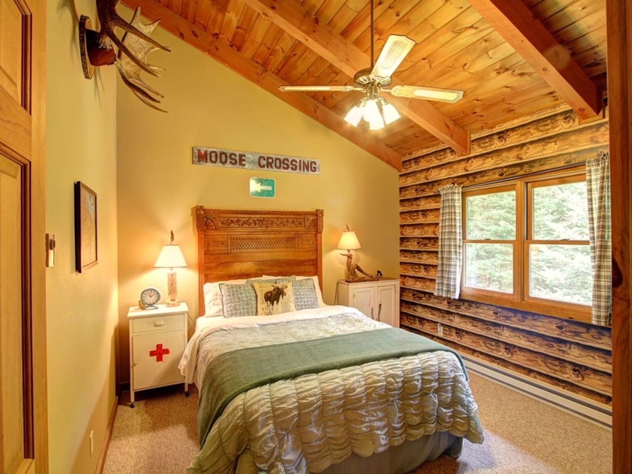 Rest peacefully in your cozy cabin bedroom with rustic wood beams and warm wilderness decor creating the perfect mountain retreat.