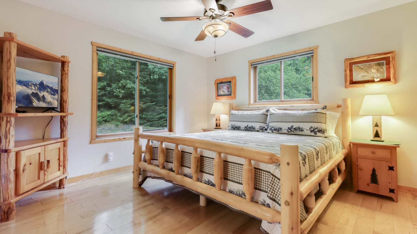 Drift off peacefully in your cozy log cabin bedroom, surrounded by forest views and rustic charm that makes every moment feel like a mountain retreat.