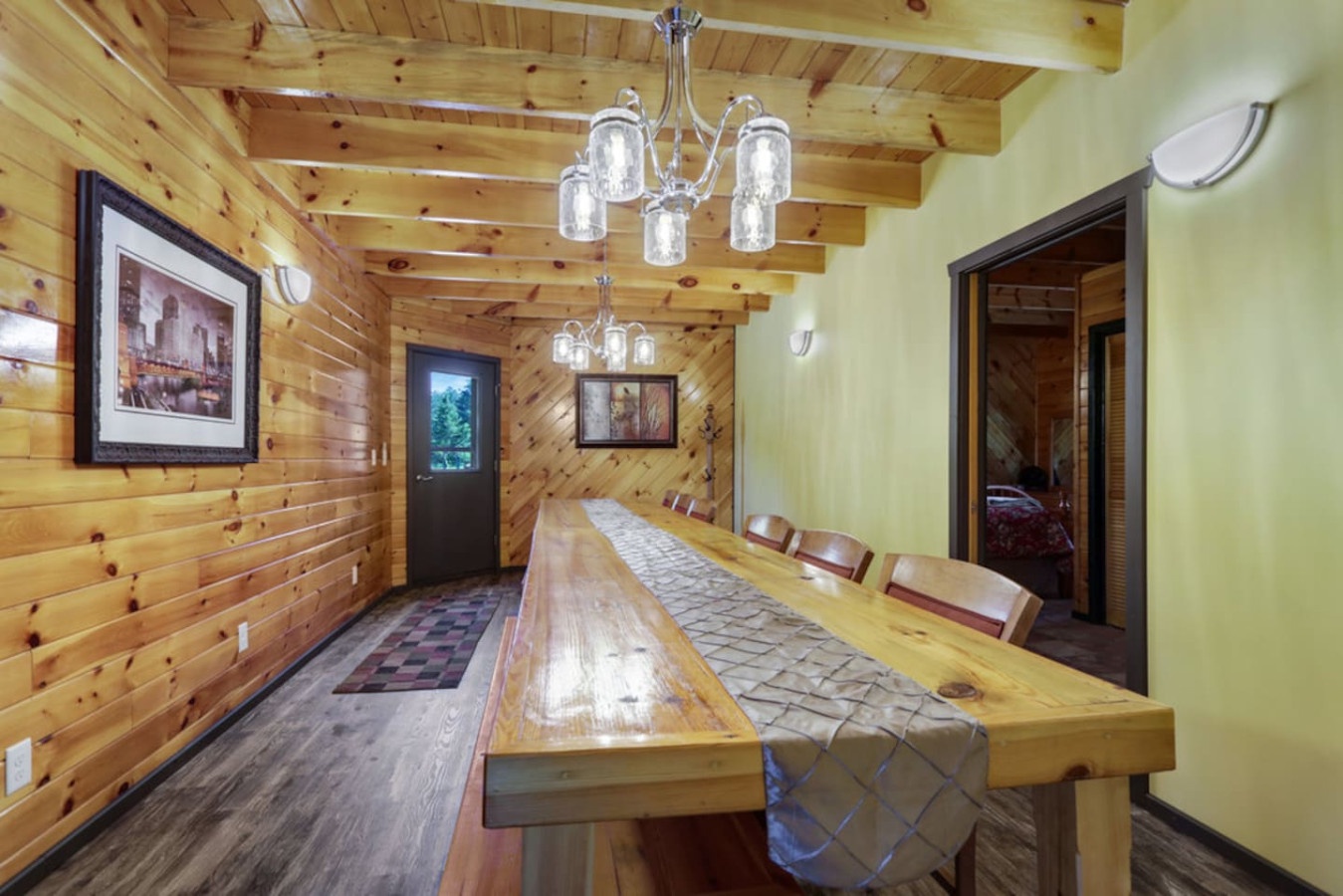 Gather around this stunning rustic dining table for memorable meals with your group in this beautifully crafted log cabin retreat.