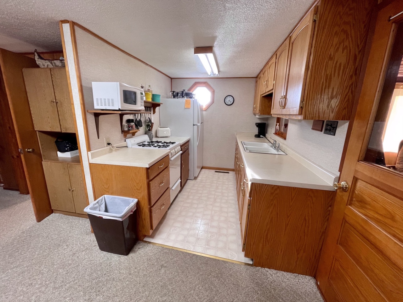 Your fully equipped galley kitchen offers everything for meal prep, from microwave to full-size appliances, with ample counter space.