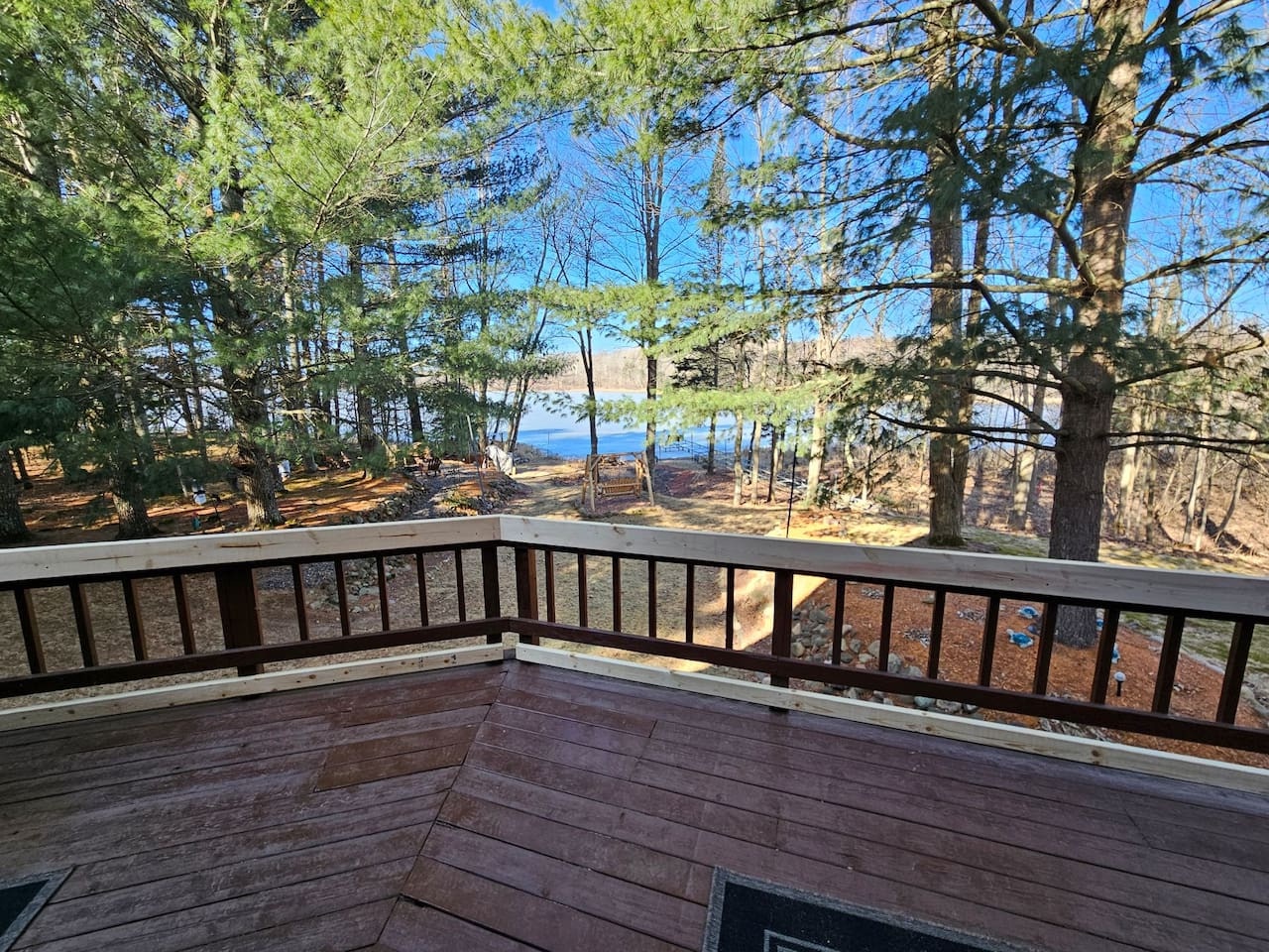 Step onto your private deck and soak in stunning lake views through towering trees, where morning coffee tastes better.