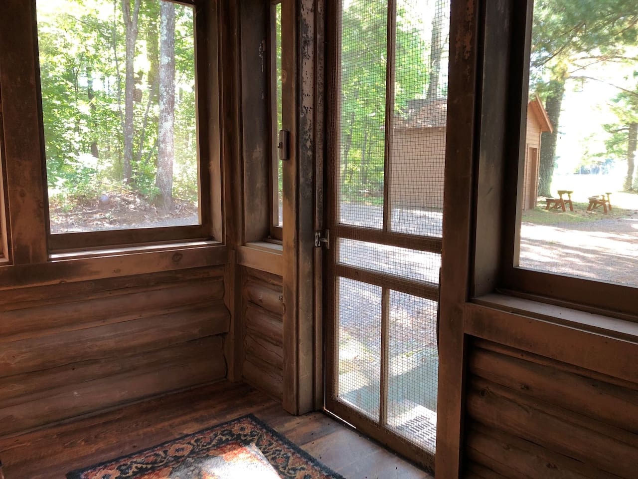 Your screened-in porch opens to peaceful forest views, where morning coffee tastes better surrounded by nature's tranquility.