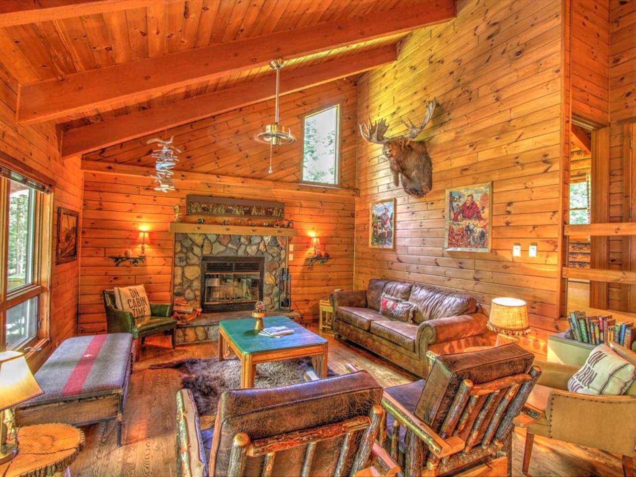 Curl up in this cozy cabin living room where rustic charm meets comfort—your perfect retreat awaits.