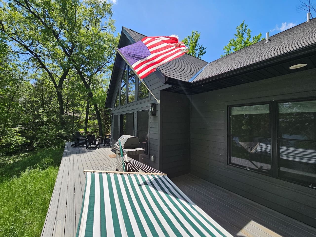 Relax in your private hammock on this spacious deck, surrounded by lush forest and peaceful summer days.