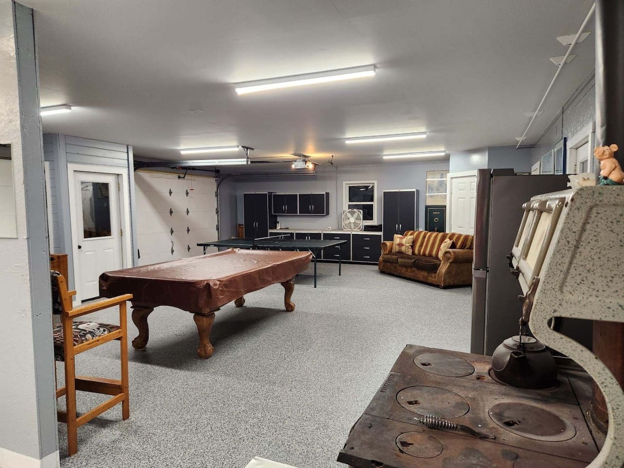 Your private game room awaits with a full-size pool table, cozy seating, and entertainment space for memorable evenings with friends.