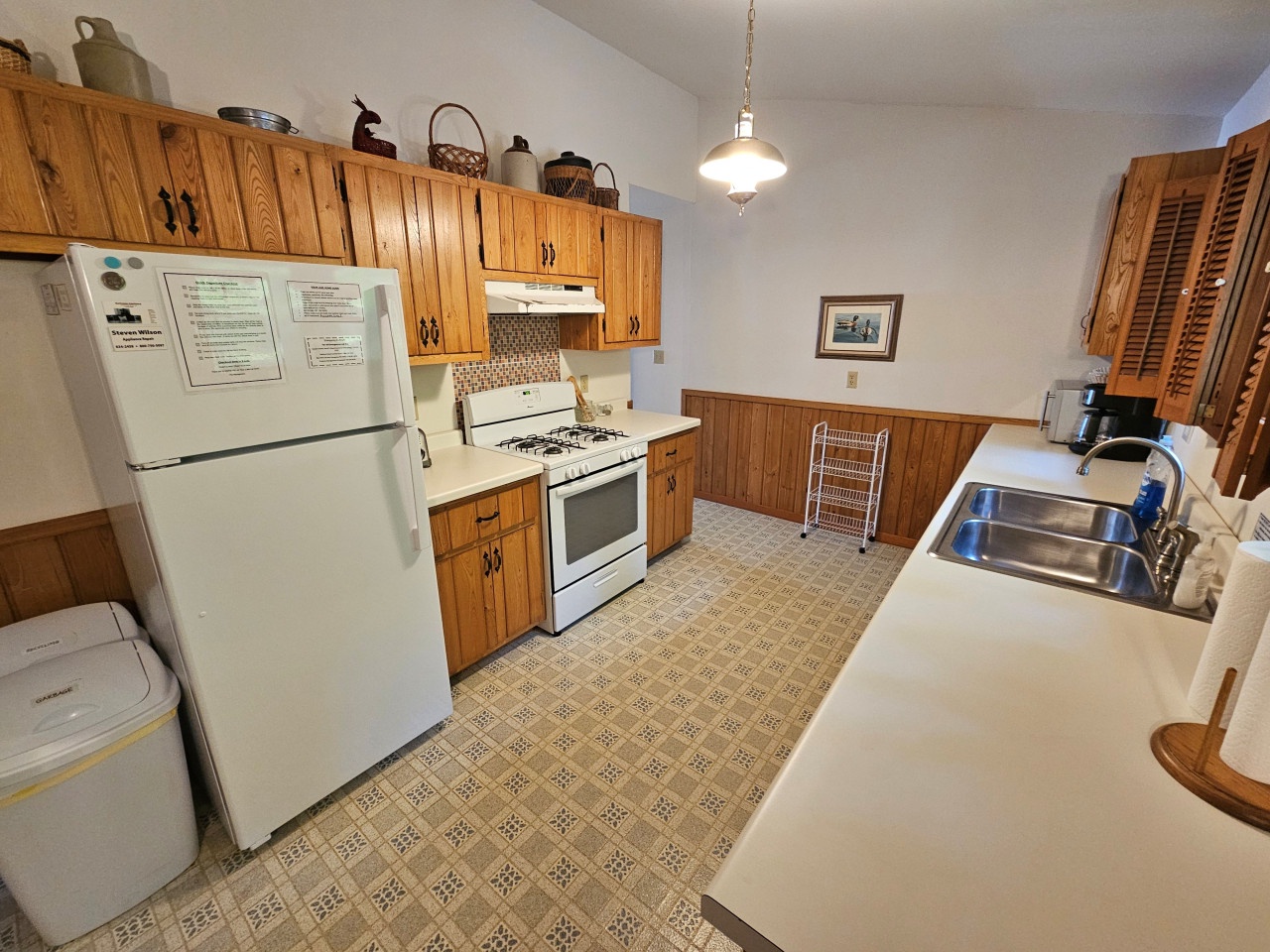 Cook up memorable meals in your spacious kitchen featuring warm wood cabinets, full appliances, and plenty of counter space for culinary adventures.