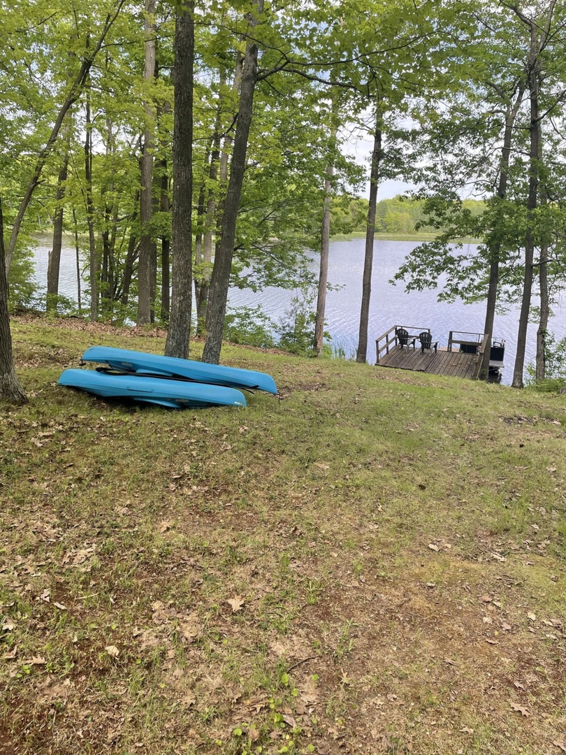 Grab a kayak and paddle out on the peaceful lake, then return to relax by the private dock surrounded by towering trees.