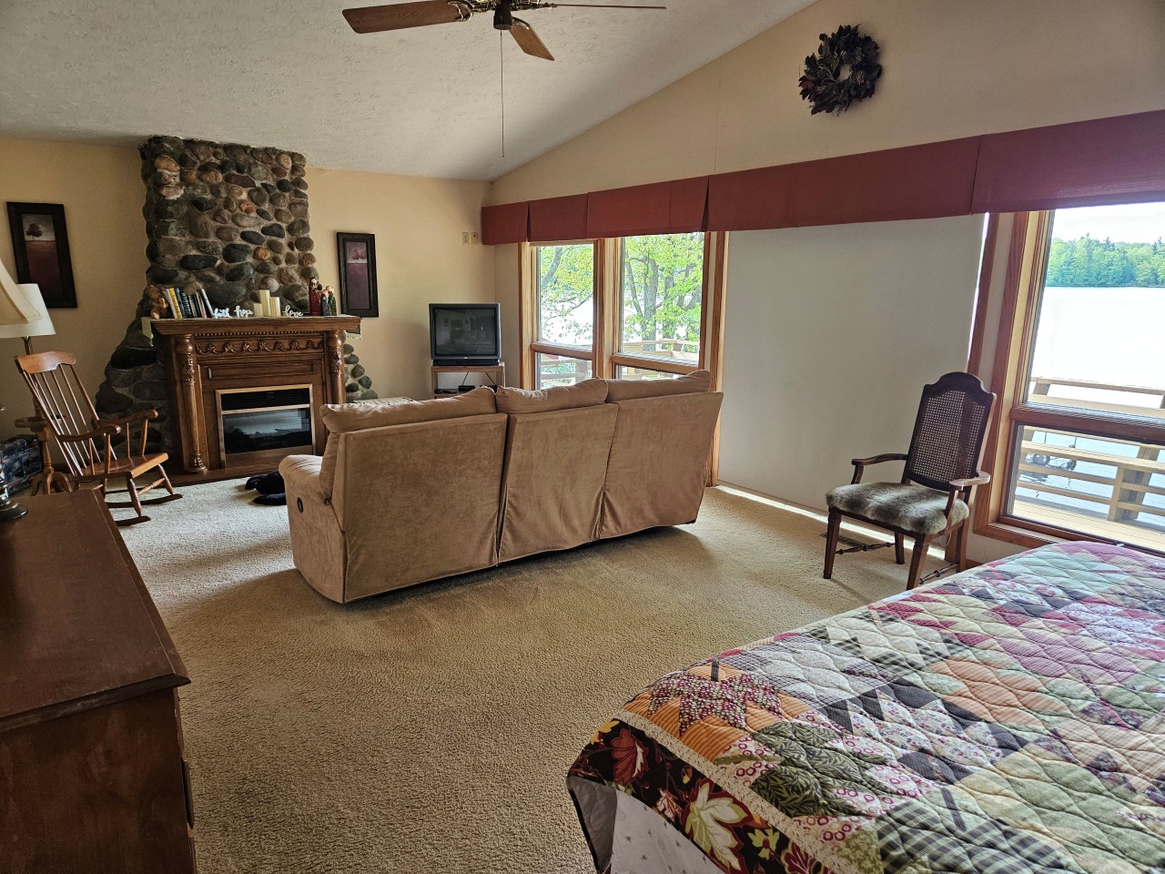 Cozy up by your stone fireplace while watching TV, then drift off to sleep with stunning lake views from your window.