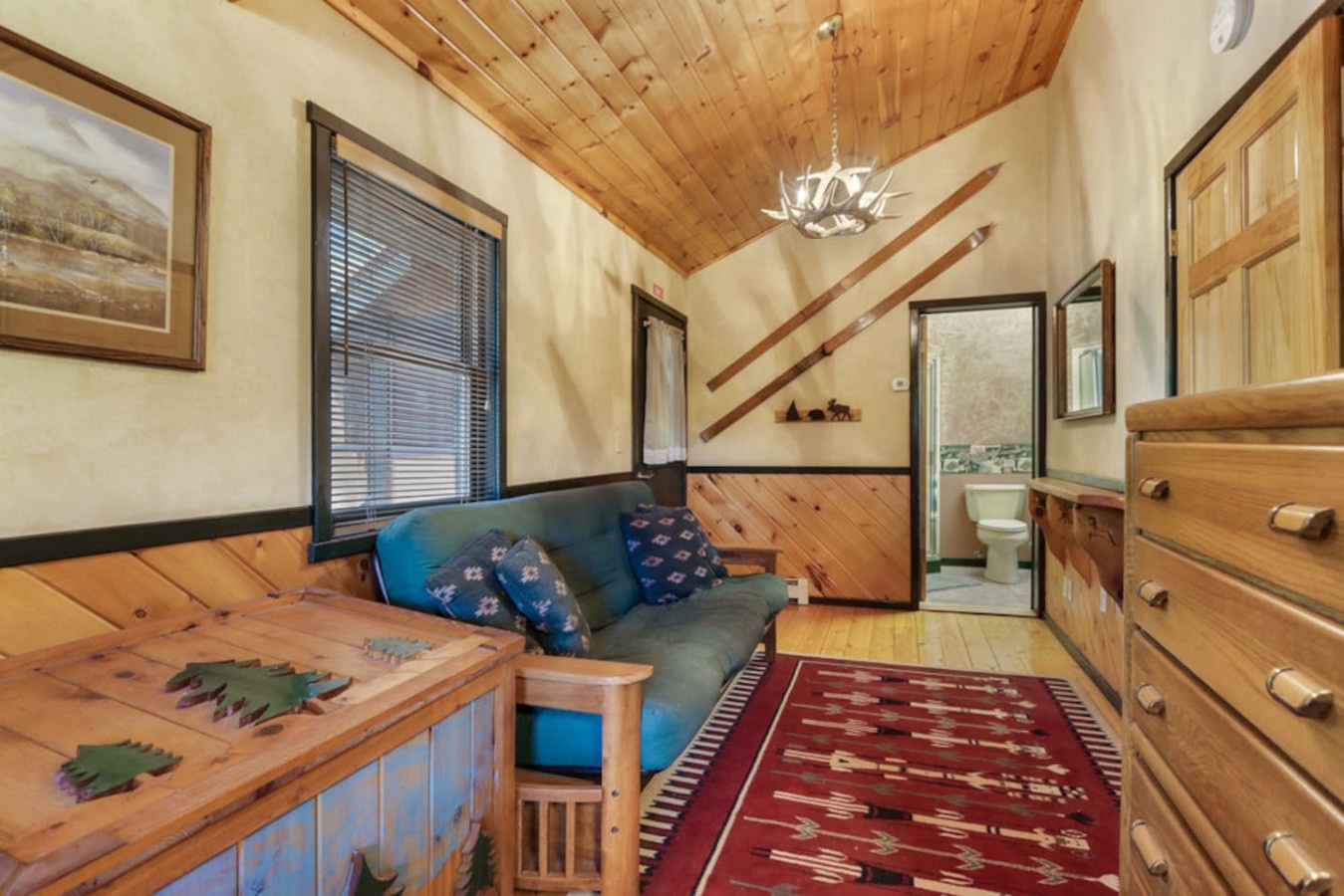 Unwind in your cozy rustic retreat with warm wood accents, comfortable seating, and charming cabin décor that makes you feel right at home.