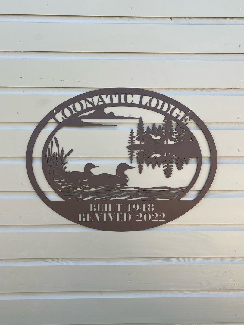 Discover rustic charm with this handcrafted wooden lodge sign featuring nature's beauty and established heritage dating back to 2002.