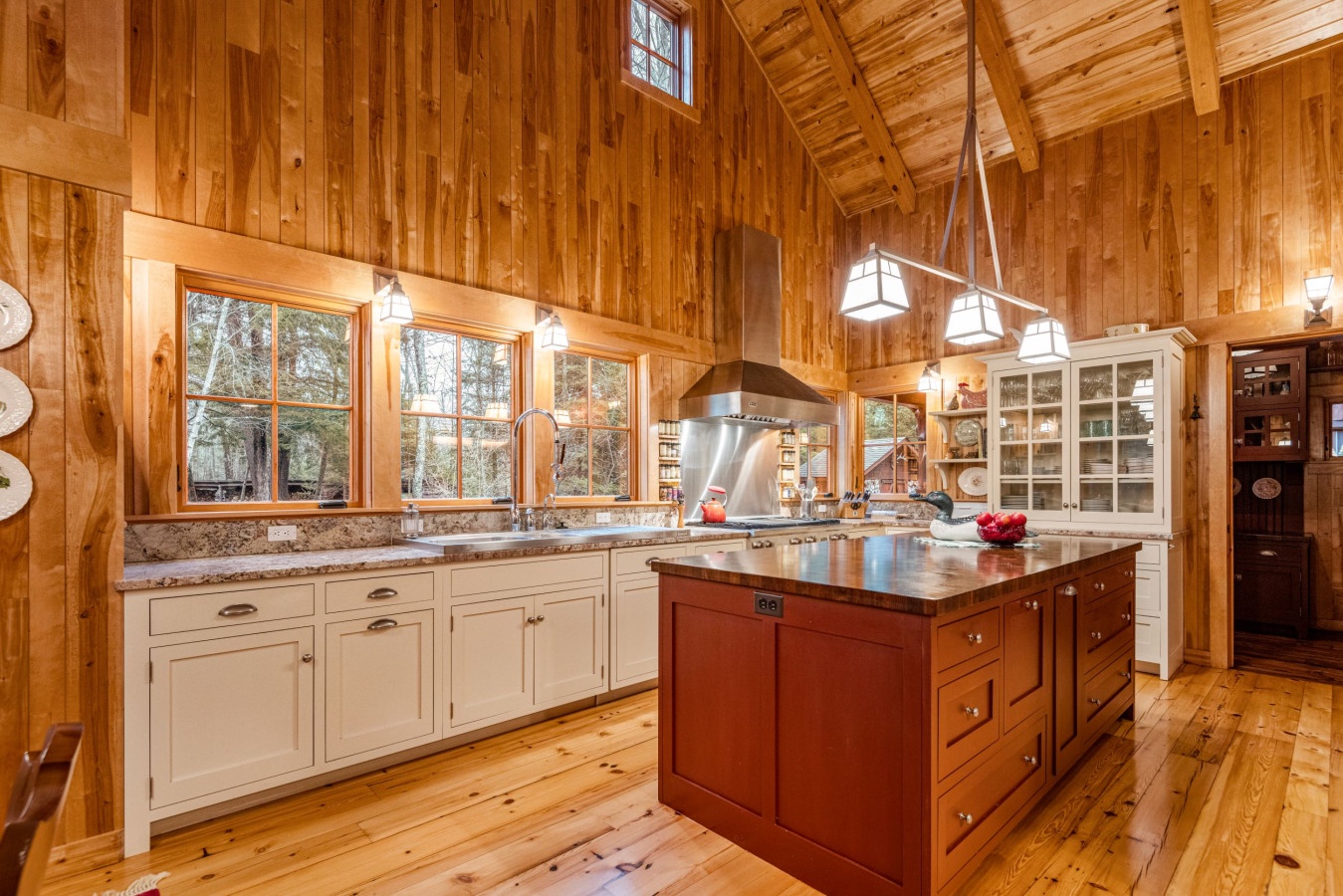 Your rustic dream kitchen awaits with rich wood beams, granite counters, and a perfect island for preparing memorable meals together.
