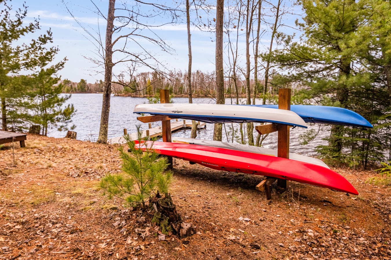 Grab your paddle and explore the pristine lake - colorful kayaks await your next adventure from this beautiful waterfront setting.