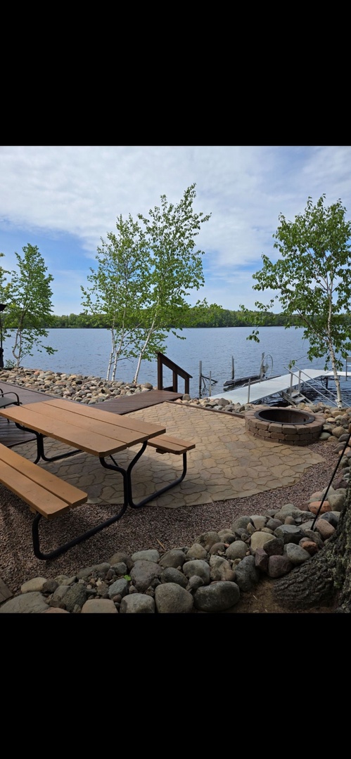 Your private lakeside retreat awaits with a picnic table overlooking serene waters, perfect for morning coffee or evening meals with stunning lake views.