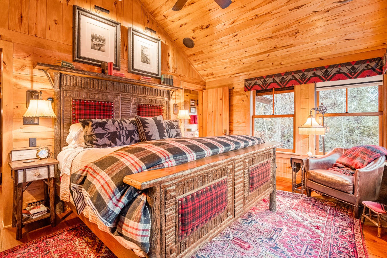 Cozy mountain cabin bedroom with rustic wood beam ceilings and plaid bedding creates your perfect alpine retreat.