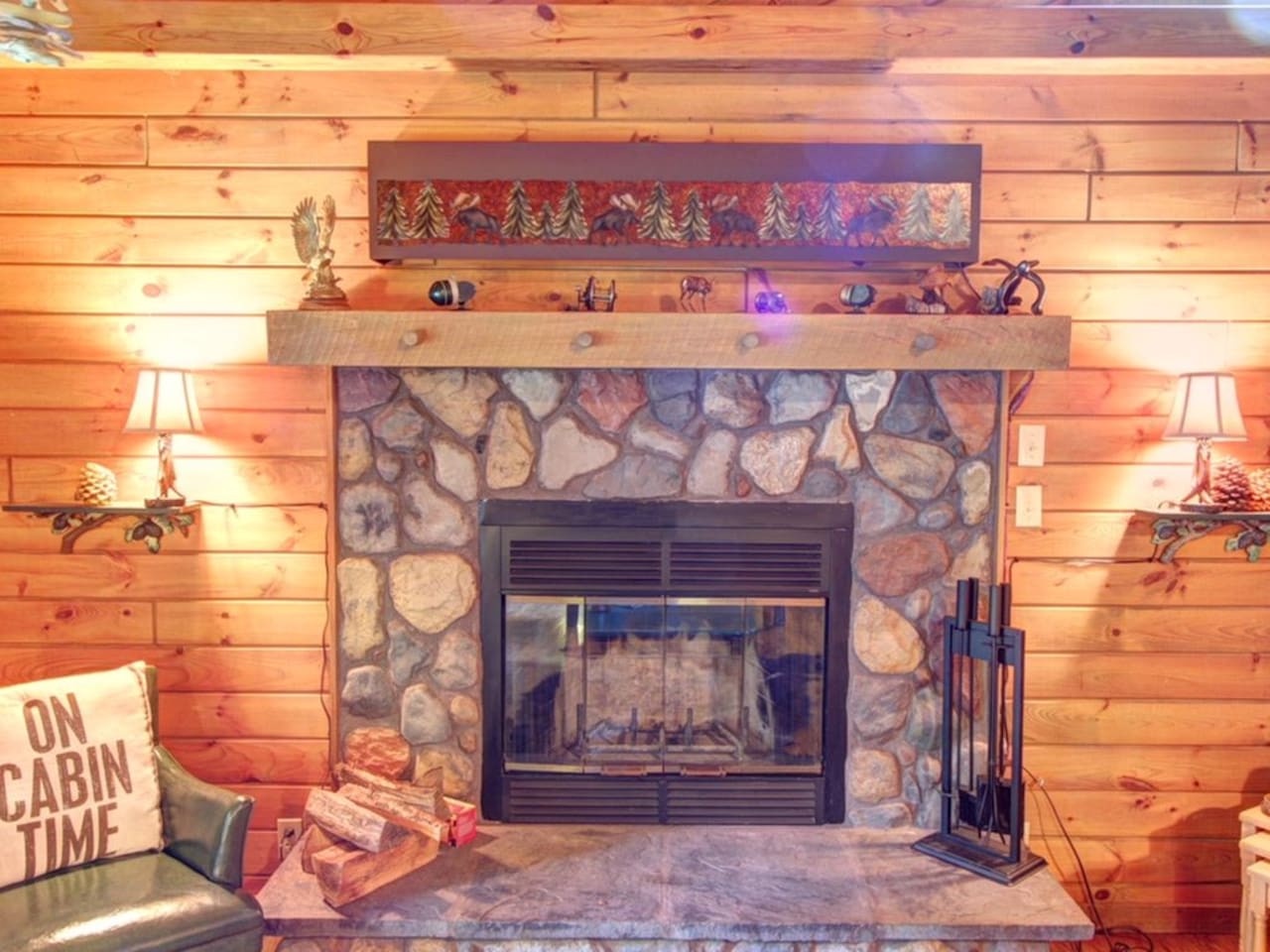 Cozy up by your stone fireplace with crackling logs and rustic cabin charm on chilly evenings.