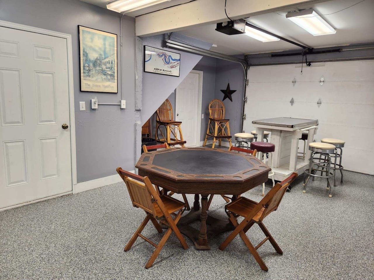 Your private game room features a poker table and high-top seating, perfect for evening entertainment with friends and family.