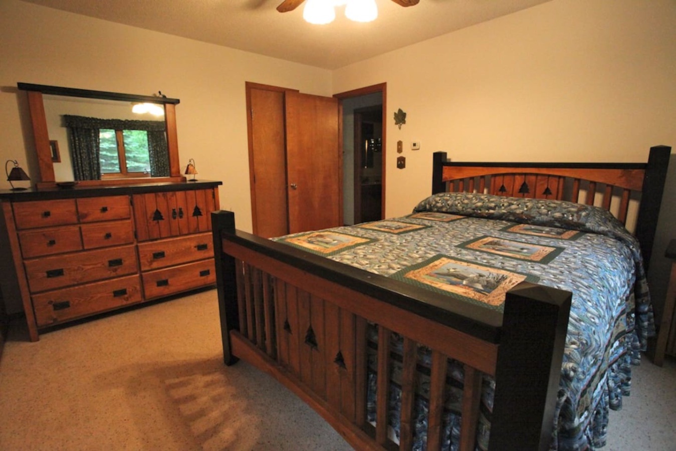 Drift off in your cozy rustic bedroom featuring handcrafted wood furniture and charming cabin-style decor.