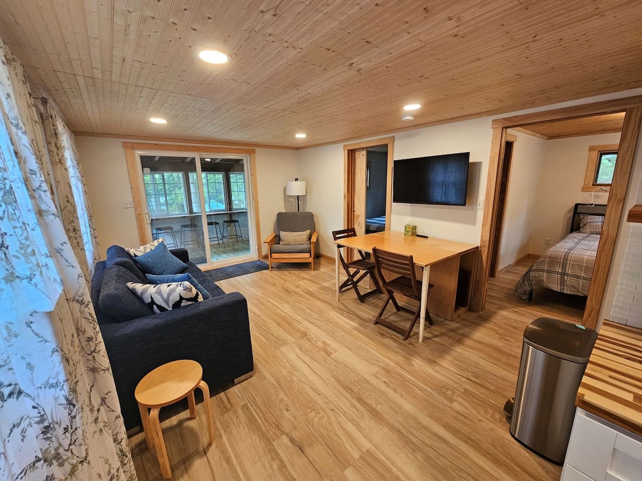 Sink into your cozy living space where warm wood and thoughtful details create your perfect mountain retreat.