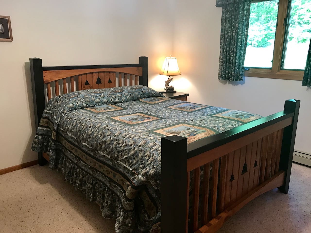 Your cozy bedroom features rustic wooden furnishings and soft lighting, creating a peaceful retreat after your mountain adventures.