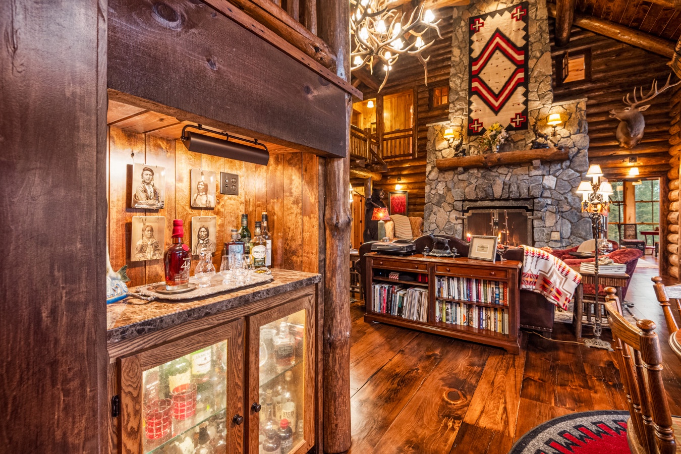 Cozy up by the stone fireplace in this rustic lodge with whiskey bar and library for perfect mountain evenings.