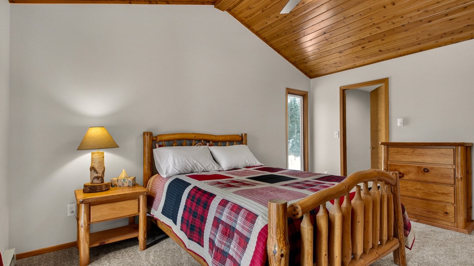 Cozy up in your rustic bedroom with warm wood beams, soft linens, and charming cabin-style furniture for peaceful nights.