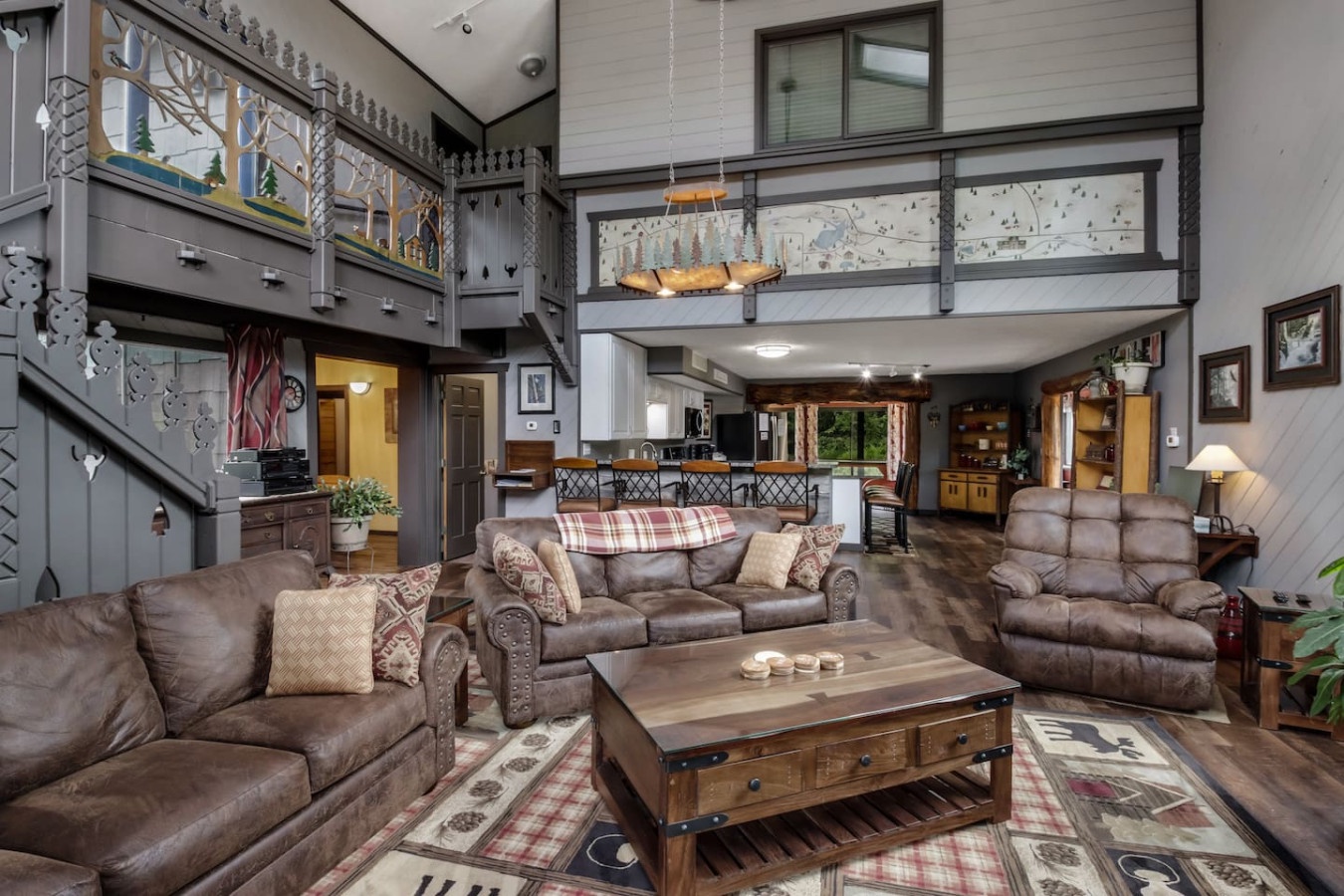 Unwind in your spacious living room with leather seating and rustic charm, while the loft adds extra space for your group.