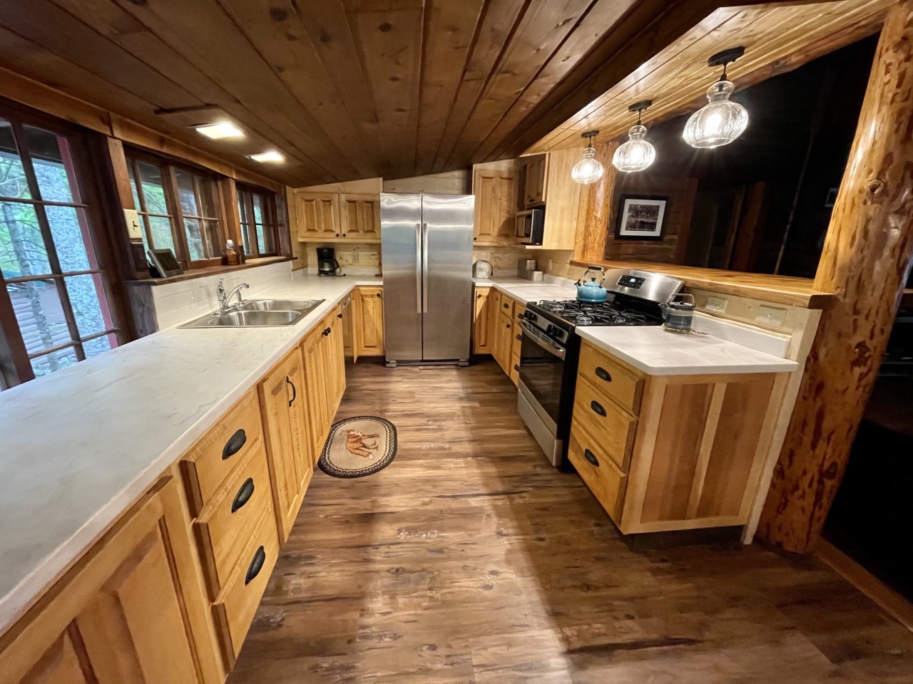 Your rustic dream kitchen awaits with warm wood cabinetry, gleaming granite counters, and stainless steel appliances perfect for creating memorable meals.