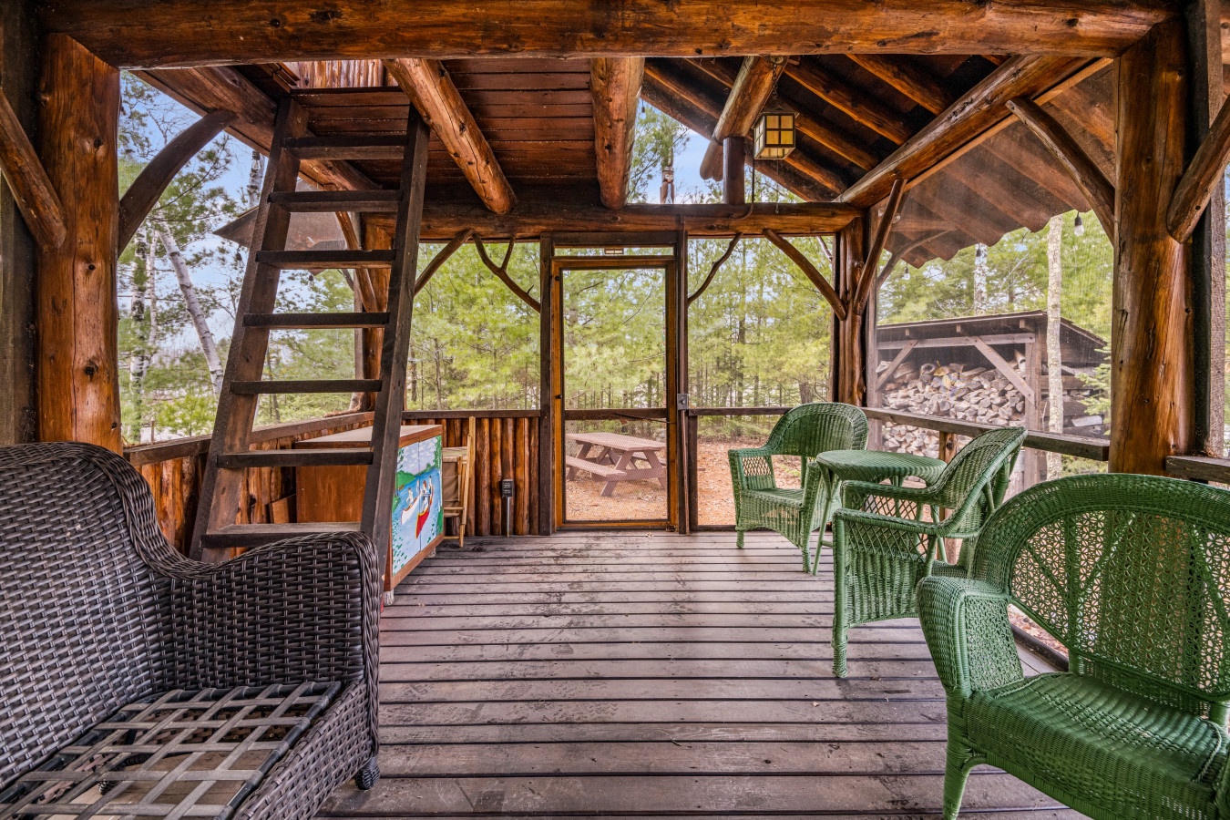 Escape to your private timber porch where rustic beams frame forest views and wicker chairs await lazy afternoons.